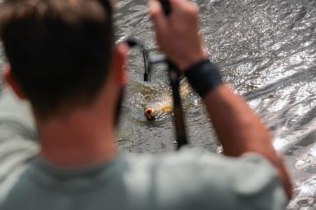 a man pulling the fishing rod